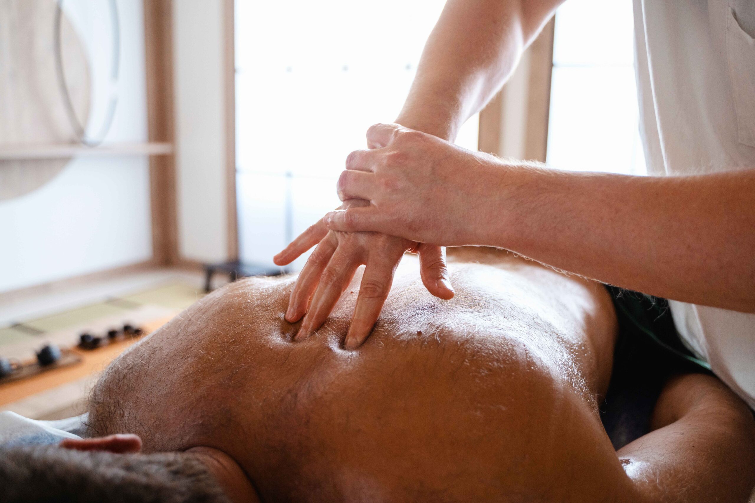 high angle man getting massage 1_11zon scaled
